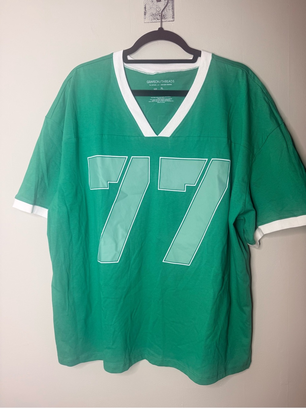 Grayson Threads Men’s Green V-Neck Jersey with White Trim and '77' Graphic